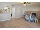 Bright dining room features a brick fireplace and a stylish ceiling fan at 8504 Soneto Ln, Las Vegas, NV 89117