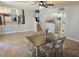 Open concept dining room with views to kitchen, natural light, and tile flooring at 8504 Soneto Ln, Las Vegas, NV 89117