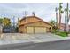 Two-story home with a three-car garage and a tile roof showing curb appeal at 8504 Soneto Ln, Las Vegas, NV 89117
