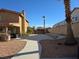 Exterior view of the home showing the front yard and driveway at 8504 Soneto Ln, Las Vegas, NV 89117