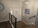 Welcoming foyer features decorative tile inlay, stylish front door with sidelights, and modern railing at 8504 Soneto Ln, Las Vegas, NV 89117