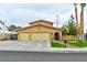 Charming home with a two-car garage, well-manicured lawn, mature trees, and inviting curb appeal at 8504 Soneto Ln, Las Vegas, NV 89117