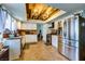 Bright kitchen with white cabinets, stainless steel appliances, and a decorative wood ceiling at 8504 Soneto Ln, Las Vegas, NV 89117