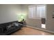 Living room with shuttered windows and a dog door at 8504 Soneto Ln, Las Vegas, NV 89117