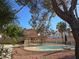 Backyard pool with fenced area and a charming tiki hut creating a relaxing outdoor oasis at 8504 Soneto Ln, Las Vegas, NV 89117