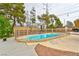 Backyard fenced in pool and surrounding patio area with gravel landscaping and some greenery at 8504 Soneto Ln, Las Vegas, NV 89117