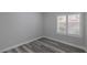 Light-filled bedroom with wood floors, window and neutral walls at 8805 Jeffreys St # 1018, Las Vegas, NV 89123