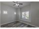 Bright bedroom featuring wood floors, plantation shutters and ceiling fan at 8805 Jeffreys St # 1018, Las Vegas, NV 89123