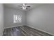 Neutral bedroom with wood floors, ceiling fan and plantation shutters at 8805 Jeffreys St # 1018, Las Vegas, NV 89123