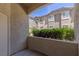Condo balcony view shows building exterior, landscaping, stairway and sky at 8805 Jeffreys St # 1018, Las Vegas, NV 89123