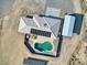 Aerial view of a home with a pool, spa, solar panels, and a metal storage building at 881 W Kathryn Ave, Pahrump, NV 89060