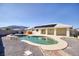 Backyard oasis with a sparkling pool, hot tub, and solar panels for eco-friendly living at 881 W Kathryn Ave, Pahrump, NV 89060