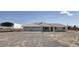 Expansive single-story home featuring a three-car garage, large front yard, and a metal barn at 881 W Kathryn Ave, Pahrump, NV 89060