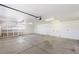Spacious three car garage with storage shelves ready for customization and parking at 881 W Kathryn Ave, Pahrump, NV 89060
