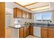 This kitchen features granite countertops and light wood cabinets at 881 W Kathryn Ave, Pahrump, NV 89060