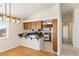 Bright kitchen boasts wood cabinets, granite counters, and a convenient breakfast bar at 881 W Kathryn Ave, Pahrump, NV 89060