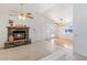 Bright living room featuring a cozy fireplace and access to the outdoors at 881 W Kathryn Ave, Pahrump, NV 89060