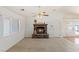 Cozy living room with stone fireplace and lots of natural light at 881 W Kathryn Ave, Pahrump, NV 89060