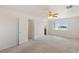 Spacious main bedroom with natural light, ceiling fan, and en-suite bathroom access at 881 W Kathryn Ave, Pahrump, NV 89060