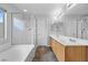 This bathroom features a double vanity, a tub, and a glass enclosed shower at 9107 Wine Cellar Ave, Las Vegas, NV 89148