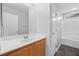 This bathroom has a single sink vanity, a tub shower, and updated fixtures at 9107 Wine Cellar Ave, Las Vegas, NV 89148