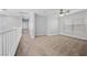 A spacious bedroom with neutral carpeting, fan, and lots of natural light from the multiple windows at 9107 Wine Cellar Ave, Las Vegas, NV 89148