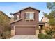 Charming two-story home with a well-maintained lawn and a two-car garage at 9107 Wine Cellar Ave, Las Vegas, NV 89148