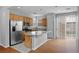 Well-equipped kitchen with stainless steel refrigerator and a breakfast bar at 9107 Wine Cellar Ave, Las Vegas, NV 89148