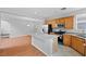 Modern kitchen with stainless steel appliances, tile floors and a center island at 9107 Wine Cellar Ave, Las Vegas, NV 89148