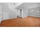 Spacious living room featuring gleaming hardwood floors and a staircase at 9107 Wine Cellar Ave, Las Vegas, NV 89148