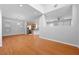 Open-concept space with hardwood floors and neutral paint with a modern ceiling fan at 9107 Wine Cellar Ave, Las Vegas, NV 89148