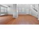 Bright living room featuring hardwood floors, neutral paint and staircase at 9107 Wine Cellar Ave, Las Vegas, NV 89148