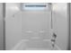 A bright shower with white tile, built-in seat, and neutral grout at 9107 Wine Cellar Ave, Las Vegas, NV 89148