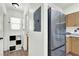 Hallway with a view of the kitchen appliances and pantry, plus a closet with shelving at 9322 Straw Hays St # 101, Las Vegas, NV 89178