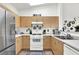 Modern kitchen with stainless steel appliances, wood cabinets, and a bright, welcoming atmosphere at 9322 Straw Hays St # 101, Las Vegas, NV 89178
