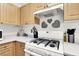 Close-up of kitchen featuring a modern gas range and sleek countertops at 9322 Straw Hays St # 101, Las Vegas, NV 89178