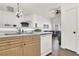 Functional kitchen with stainless steel appliances, a breakfast bar, and a seamless transition to the adjacent living area at 9322 Straw Hays St # 101, Las Vegas, NV 89178