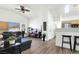 Open-concept living area with wood floors and plenty of natural light at 9322 Straw Hays St # 101, Las Vegas, NV 89178