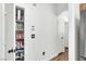 Walk-in pantry stocked with food items and white walls, plus a door to another room at 9322 Straw Hays St # 101, Las Vegas, NV 89178