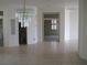 Open dining area featuring tile flooring and a modern chandelier at 10112 Plomosa Pl, Las Vegas, NV 89134
