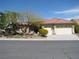 Beautiful home featuring desert landscaping, a two-car garage, and a clay tile roof in a well-kept neighborhood at 10112 Plomosa Pl, Las Vegas, NV 89134