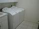 Functional laundry room with a side-by-side washer and dryer setup, plus a utility sink at 10112 Plomosa Pl, Las Vegas, NV 89134
