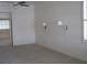 Neutral colored main bedroom with carpeted flooring, sconce lighting and bathroom access at 10112 Plomosa Pl, Las Vegas, NV 89134