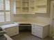 Bright home office featuring a custom built-in desk, cabinets, and shelving, perfect for remote work at 10112 Plomosa Pl, Las Vegas, NV 89134