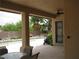 Inviting covered patio with view of pool, lush greenery, and access to outdoor space at 10112 Plomosa Pl, Las Vegas, NV 89134