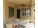 Comfortable covered patio with outdoor seating, a ceiling fan, and scenic views of the backyard at 10112 Plomosa Pl, Las Vegas, NV 89134
