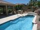 Inviting pool with a built-in spa and outdoor kitchen, perfect for relaxation and entertaining at 10112 Plomosa Pl, Las Vegas, NV 89134