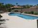 Inviting backyard pool featuring a built-in spa, grill, and plenty of space for poolside lounging at 10112 Plomosa Pl, Las Vegas, NV 89134