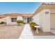 Attractive home featuring a tiled roof, a well-manicured lawn, and a charming front entrance with a bird bath at 10309 Georgetown Pl, Las Vegas, NV 89134