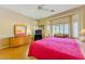 Bright bedroom featuring a bay window and wood floors at 10720 Bennington Ct, Las Vegas, NV 89134
